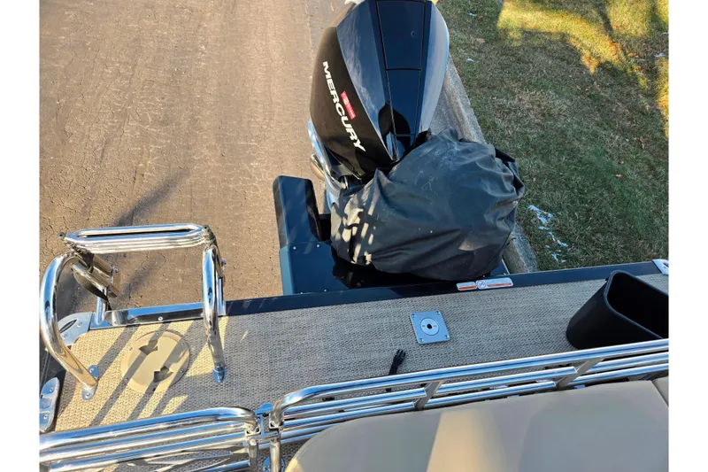 Slide: The Image of 2024 Regency 250 LE3 Sport boat with Mercury outboard motor, rear view. - 17