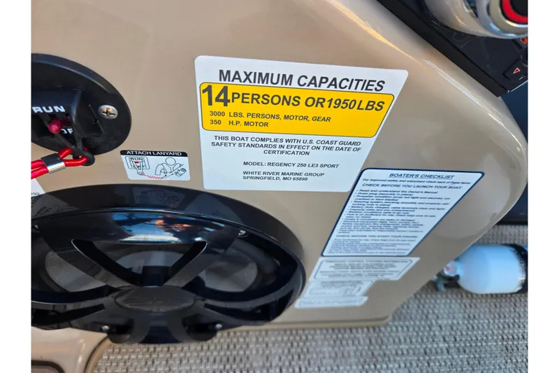 Slide: The Image of 2024 Regency 250 LE3 Sport capacity label, 14 persons or 1950 lbs, safety compliance details. - 20