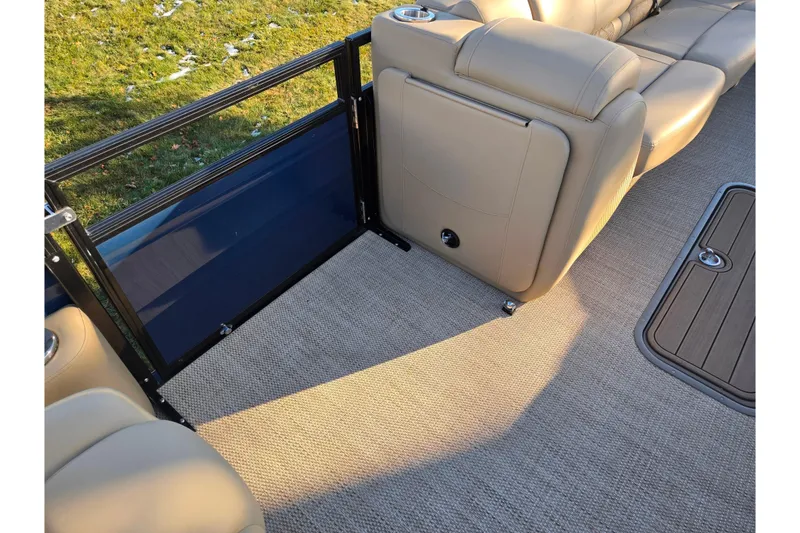 Slide: The Image of 2024 Regency 250 LE3 Sport interior with beige seating and carpeted flooring. - 22