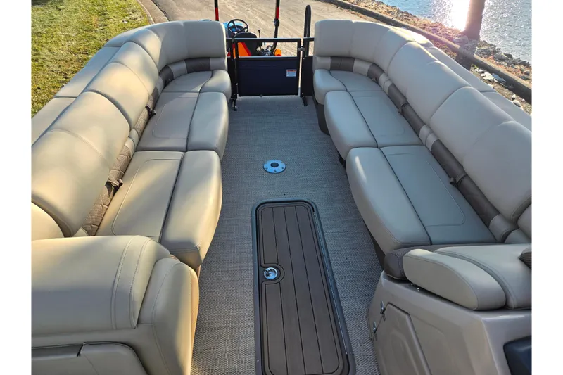 Slide: The Image of 2024 Regency 250 LE3 Sport pontoon boat with spacious seating and elegant interior design. - 23