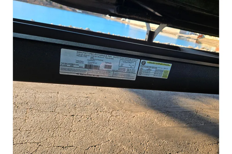 Slide: The Image of 2024 Regency 250 LE3 Sport trailer label with specifications and manufacturing details. - 8