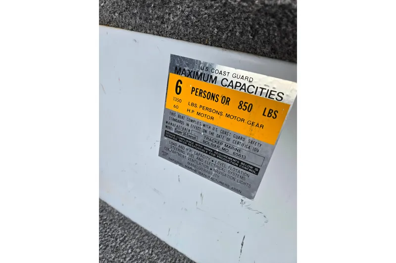 Slide: The Image of 1994 Tracker Pro Deep V-16 capacity label, 6 persons or 850 lbs, U.S. Coast Guard compliant. - 18