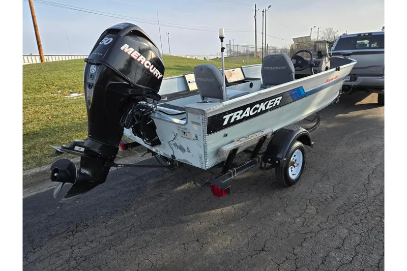 Slide: The Image of 1994 Tracker Pro Deep V-16 boat with Mercury outboard motor on trailer. - 3