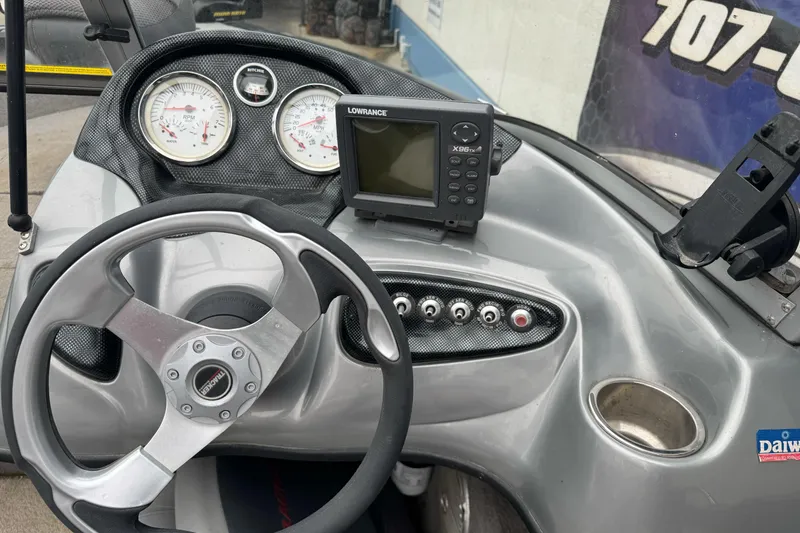 Slide: The Image of 2010 Tracker Targa 17 dashboard with steering wheel, gauges, and Lowrance X96 fishfinder. - 12