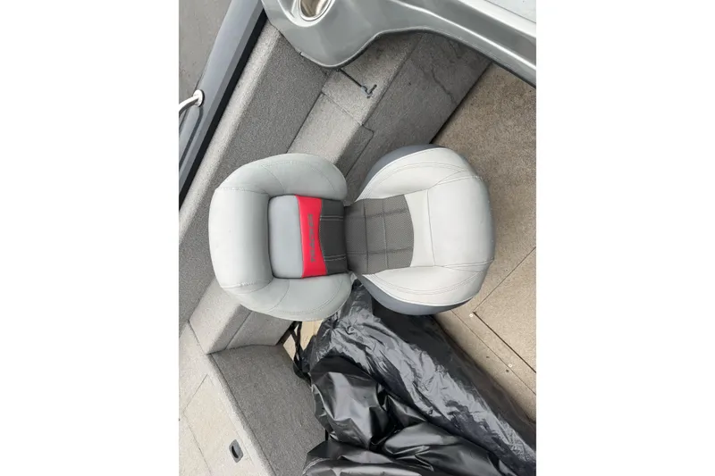 Slide: The Image of Gray seat in a 2010 Tracker Targa 17 boat interior. - 13