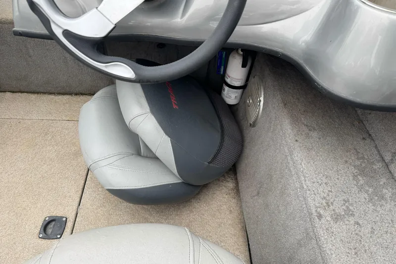 Slide: The Image of 2010 Tracker Targa 17 boat interior with steering wheel and seat detail. - 14