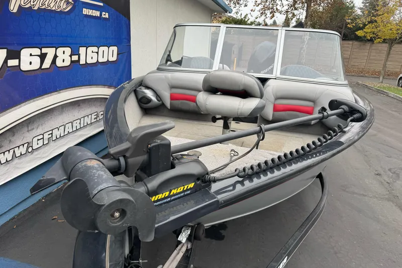 Slide: The Image of 2010 Tracker Targa 17 boat with Minn Kota trolling motor, parked outdoors. - 4