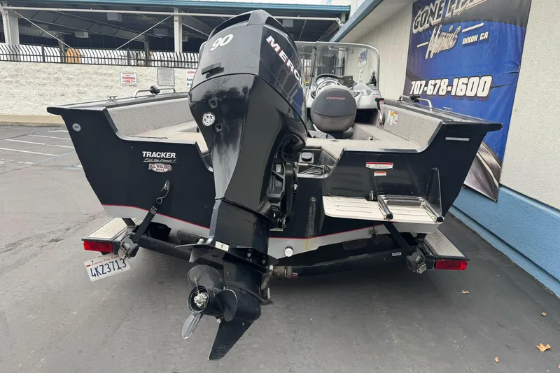 Slide: The Image of 2010 Tracker Targa 17 boat with Mercury 90 engine, parked outdoors. - 9