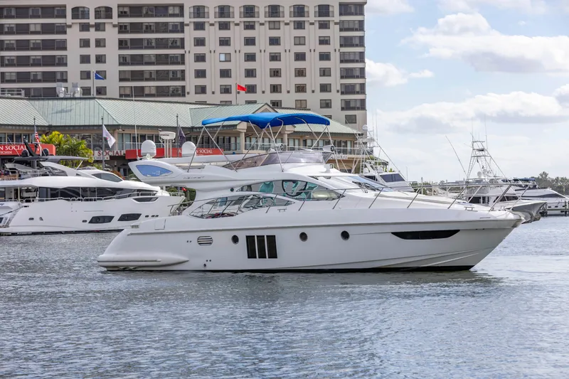 Slide: The Image of 2012 Azimut 48 Flybridge yacht docked in a marina. - 1