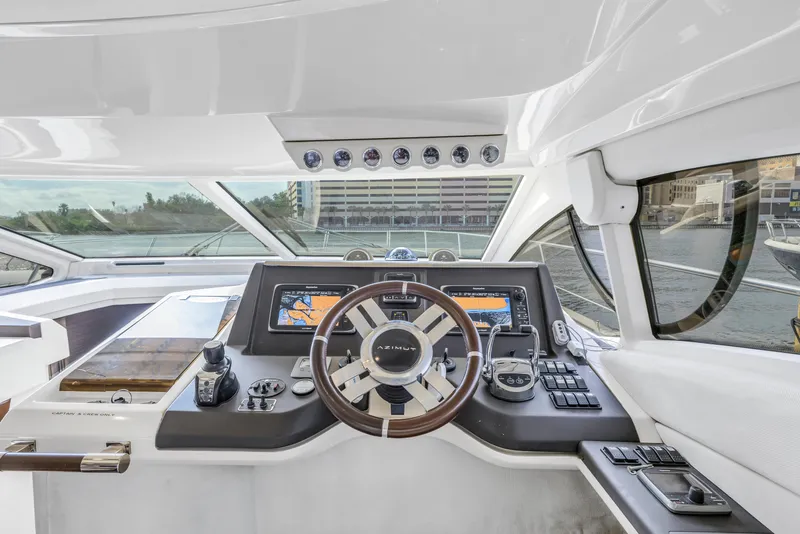 Slide: The Image of Cockpit of 2012 Azimut 48 Flybridge yacht with modern navigation equipment and steering wheel. - 16