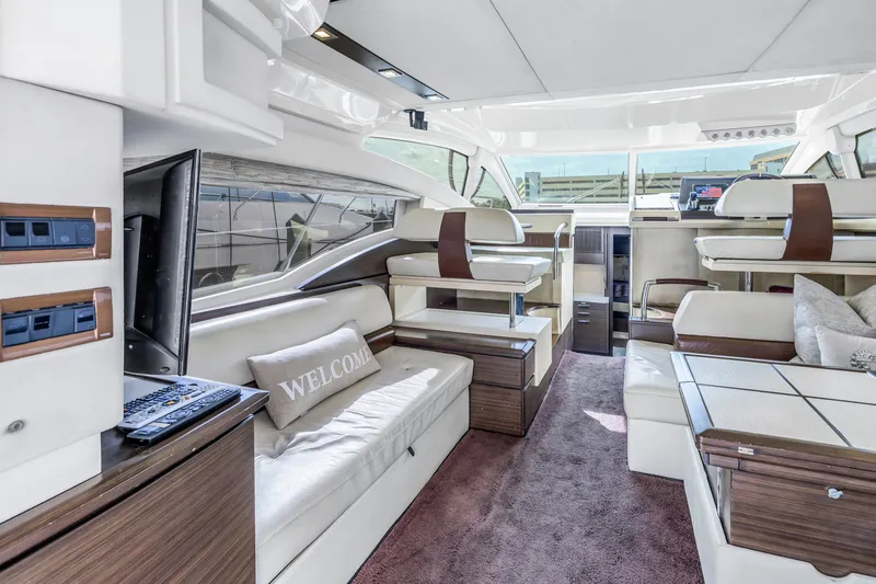 Slide: The Image of Luxurious interior of 2012 Azimut 48 Flybridge yacht with modern seating and entertainment area. - 22