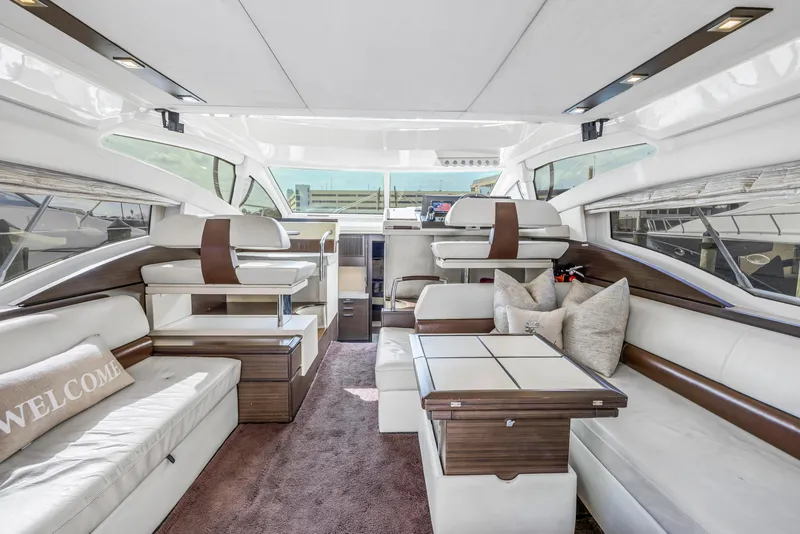 Slide: The Image of Luxurious interior of 2012 Azimut 48 Flybridge yacht with modern seating and elegant decor. - 23