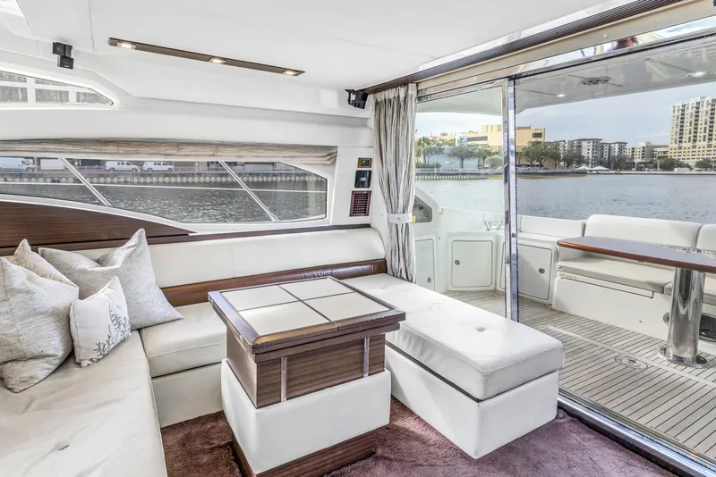 Slide: The Image of Luxurious interior of a 2012 Azimut 48 Flybridge yacht with waterfront view. - 24