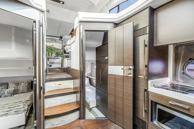 Slide: The Image of Interior of a 2012 Azimut 48 Flybridge yacht with modern wood finishes. - 27