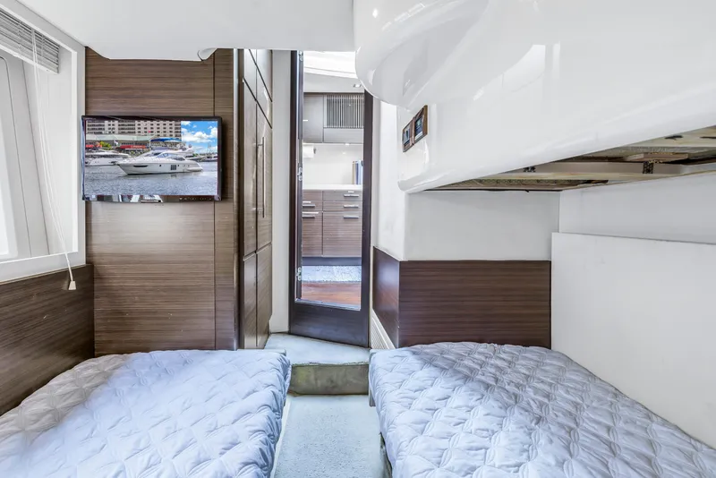 Slide: The Image of Twin cabin interior of 2012 Azimut 48 Flybridge yacht with TV and modern decor. - 29