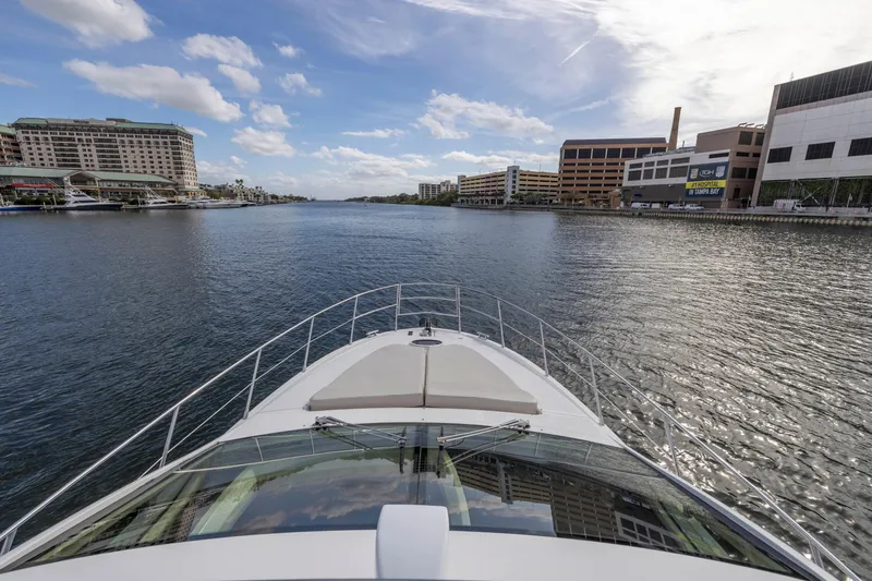 Slide: The Image of View from the bow of a 2012 Azimut 48 Flybridge yacht cruising in a city harbor. - 39