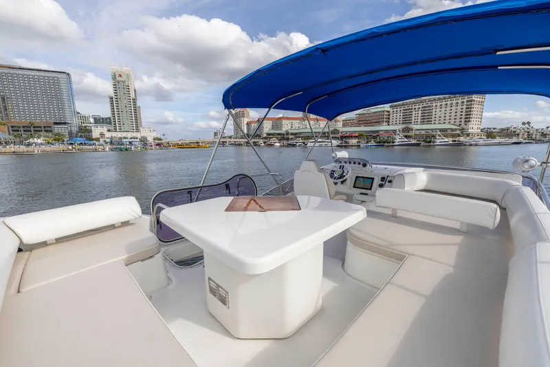 Slide: The Image of Flybridge of 2012 Azimut 48 yacht with cityscape background. - 43