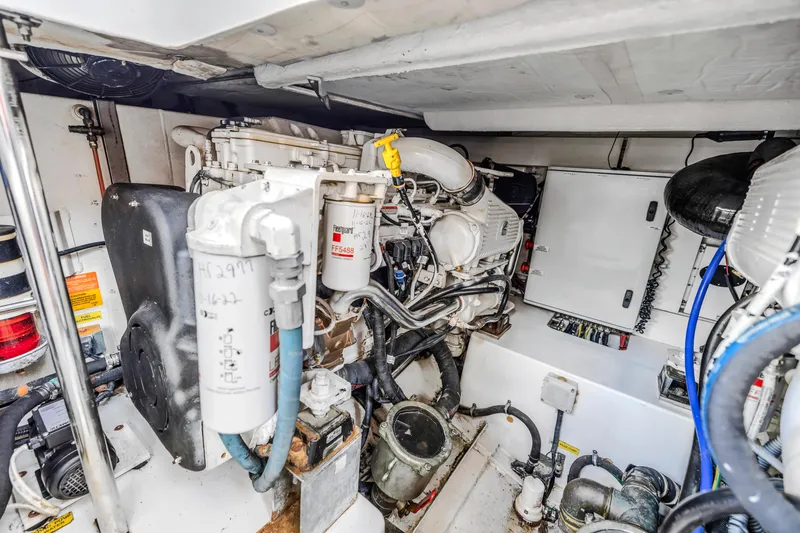 Slide: The Image of Engine room of a 2012 Azimut 48 Flybridge yacht, showcasing mechanical components. - 45