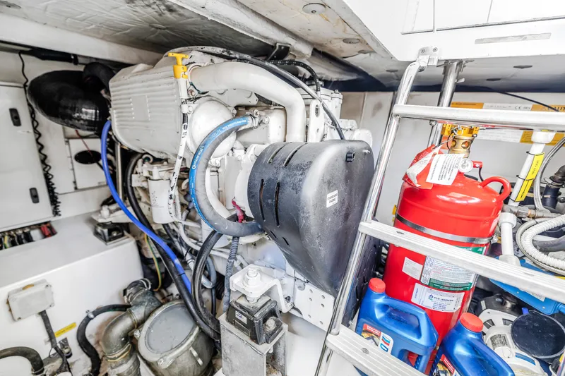 Slide: The Image of Engine room of a 2012 Azimut 48 Flybridge yacht with equipment and fire extinguisher. - 47