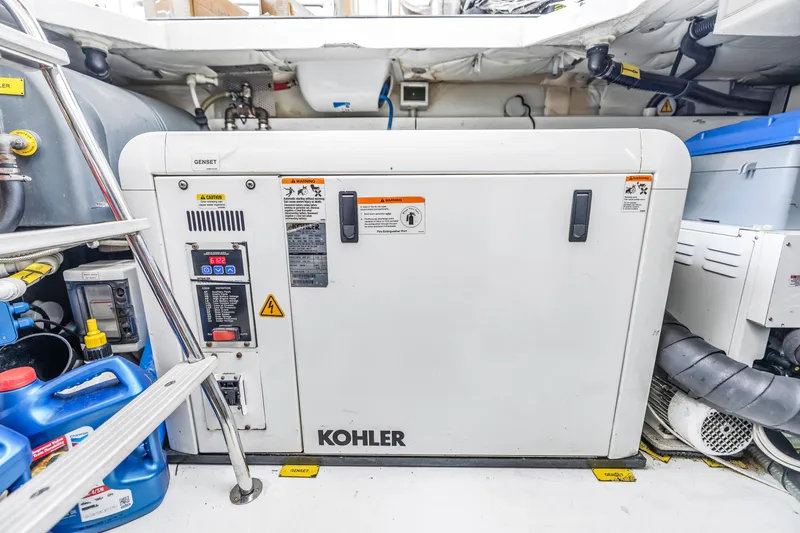 Slide: The Image of Kohler generator in the engine room of a 2012 Azimut 48 Flybridge yacht. - 48
