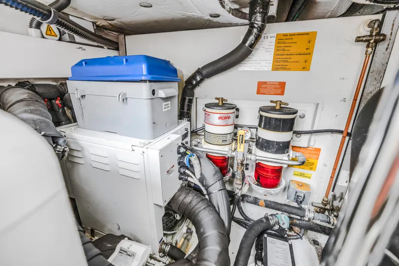 Slide: The Image of Engine room of a 2012 Azimut 48 Flybridge yacht with fuel filters and battery box. - 49