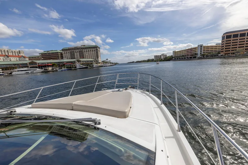 Slide: The Image of Azimut 48 Flybridge 2012 yacht cruising in a scenic urban waterfront. - 9