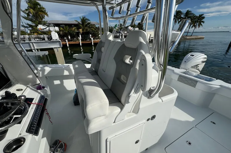 Slide: The Image of Interior of a 2022 Freeman 34VH boat with luxurious seating and modern controls. - 12
