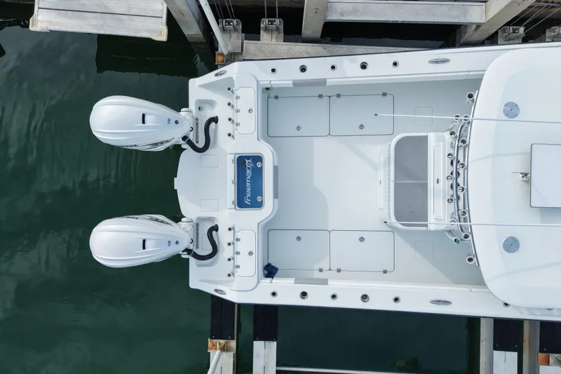 Slide: The Image of Overhead view of 2022 Freeman 34VH boat docked with dual engines. - 2