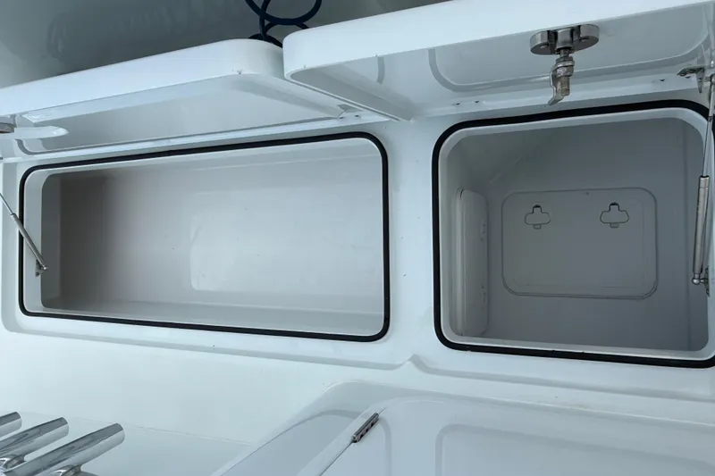 Slide: The Image of Open storage compartments on a 2022 Freeman 34VH boat. - 21