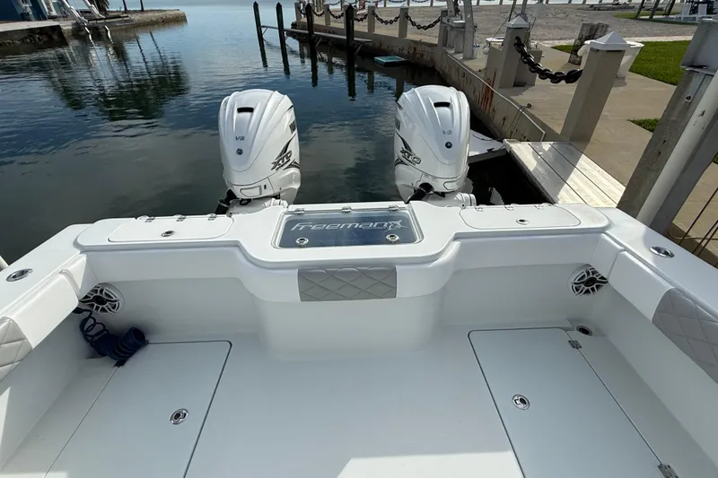Slide: The Image of 2022 Freeman 34VH boat with twin engines docked at marina. - 25