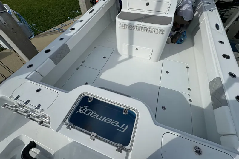 Slide: The Image of 2022 Freeman 34VH boat interior with storage compartments and seating. - 7