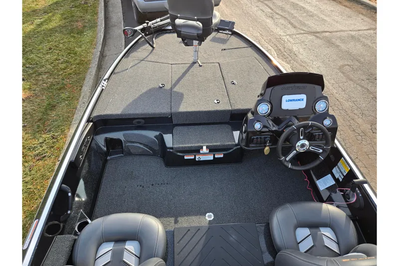 Slide: The Image of 2020 Nitro Z17 boat interior with steering wheel, Lowrance system, and seating. - 11