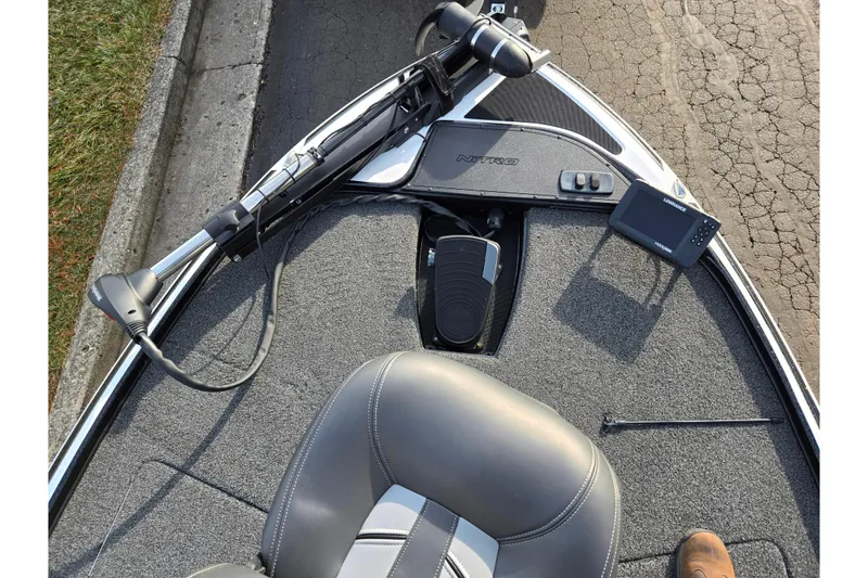 Slide: The Image of 2020 Nitro Z17 boat interior with control panel and seating. - 17