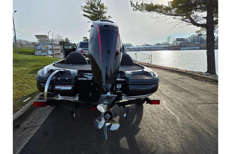 Slide: The Image of 2020 Nitro Z17 boat on trailer by lakeside, rear view. - 2