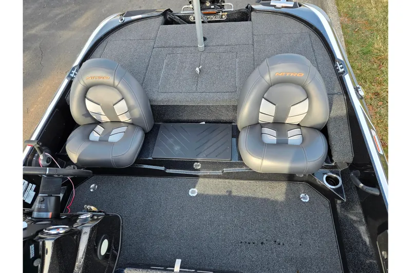 Slide: The Image of 2020 Nitro Z17 boat interior with dual gray seats and steering console. - 20
