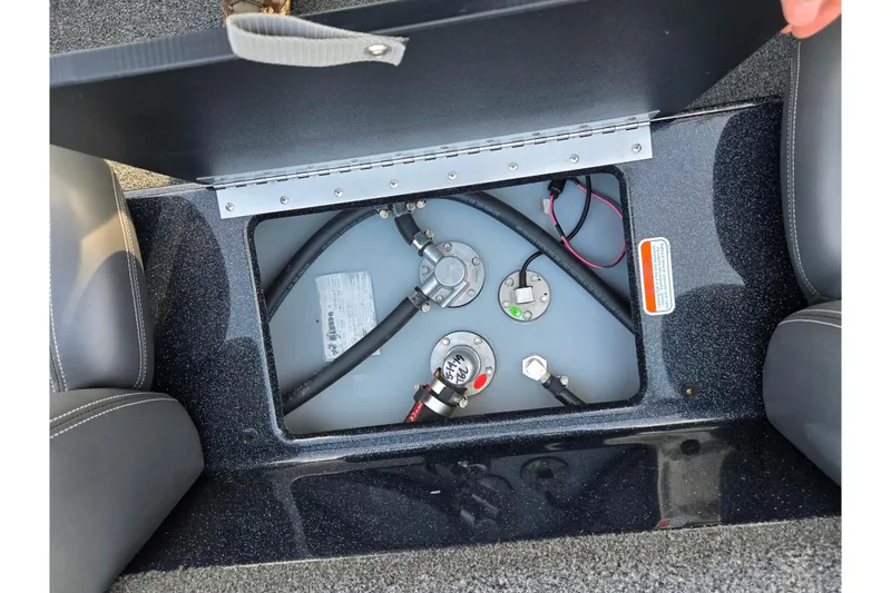 Slide: The Image of 2020 Nitro Z17 boat fuel tank compartment with hoses and gauges visible. - 21