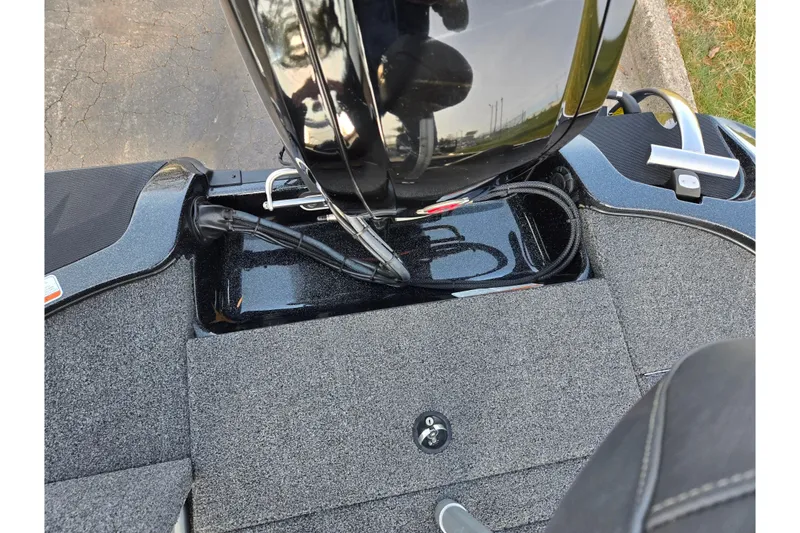 Slide: The Image of 2020 Nitro Z17 boat engine compartment with carpeted deck and wiring. - 24