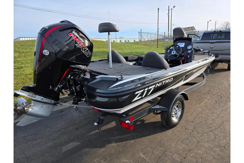 Slide: The Image of 2020 Nitro Z17 boat with Mercury engine on trailer, parked outdoors. - 3