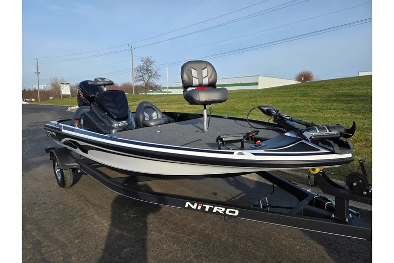 Slide: The Image of 2020 Nitro Z17 fishing boat on trailer, parked outdoors on a sunny day. - 5