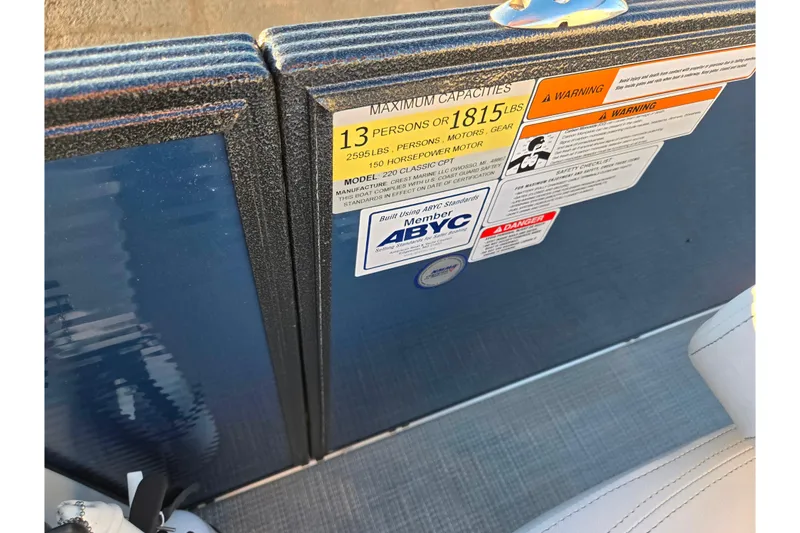 Slide: The Image of 2022 Crest Classic LX 220 capacity label, showing maximum weight and passenger limits. - 13