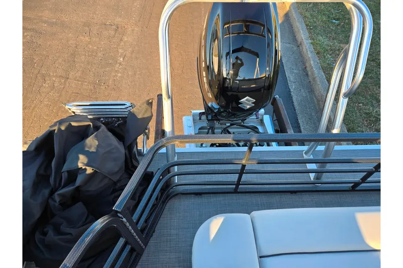 Slide: The Image of 2022 Crest Classic LX 220 boat with Suzuki outboard motor and deck view. - 18