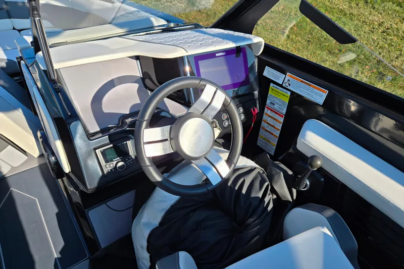 Slide: The Image of 2023 Heyday H22 boat cockpit with steering wheel and control panel. - 12