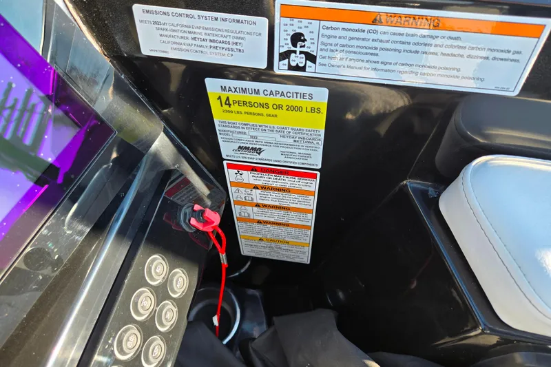 Slide: The Image of 2023 Heyday H22 boat capacity and safety warnings, accommodating 14 people or 2000 lbs. - 13