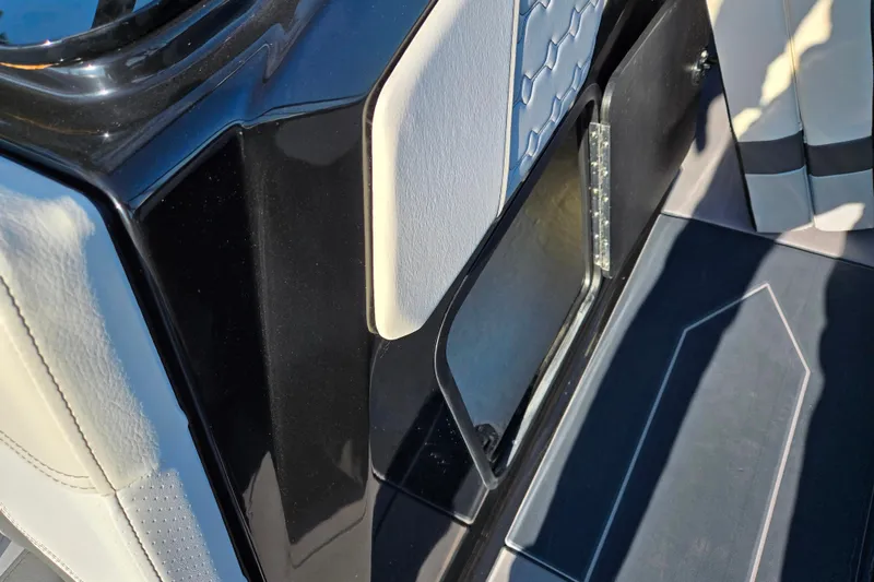 Slide: The Image of 2023 Heyday H22 boat interior with sleek black and white design details. - 14