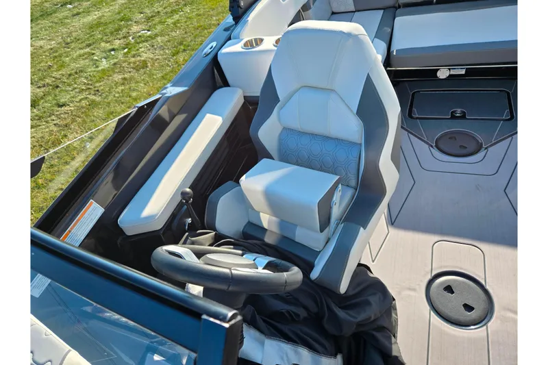 Slide: The Image of 2023 Heyday H22 boat interior with modern steering and seating design. - 19