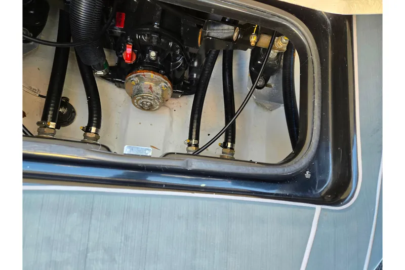 Slide: The Image of Engine compartment of 2023 Heyday H22 boat, showing hoses and mechanical components. - 21