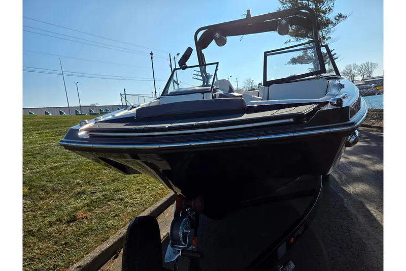 Slide: The Image of 2023 Heyday H22 boat with sleek design, parked on a sunny day. - 6