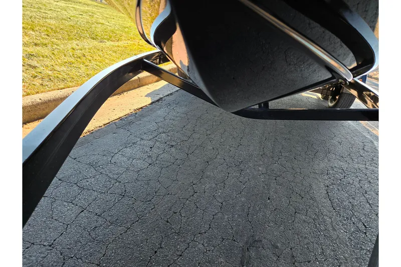 Slide: The Image of 2023 Heyday H22 boat trailer on cracked asphalt road. - 7