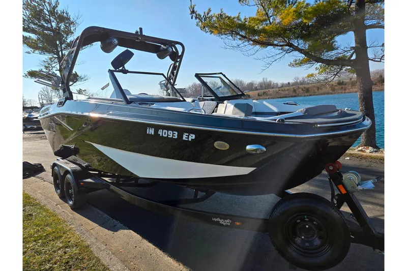 Slide: The Image of 2023 Heyday H22 boat on trailer by lakeside, under clear blue sky. - 8