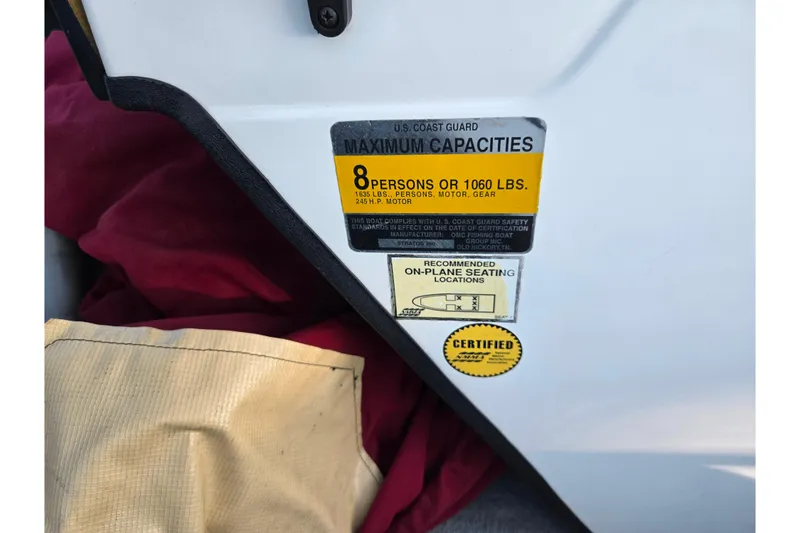 Slide: The Image of 1998 Stratos 290 Ski-N-Fish capacity label, 8 persons or 1060 lbs, certified. - 16